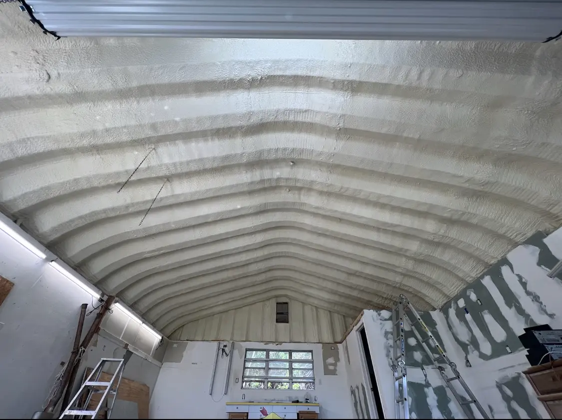 Spray polyurethane foam applied to the underside of a metal roof deck in Orange Beach